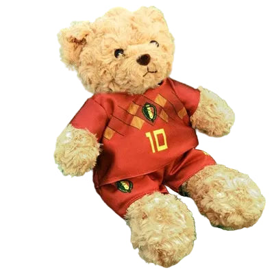Ours en peluche portant un maillot et un short de football rouges