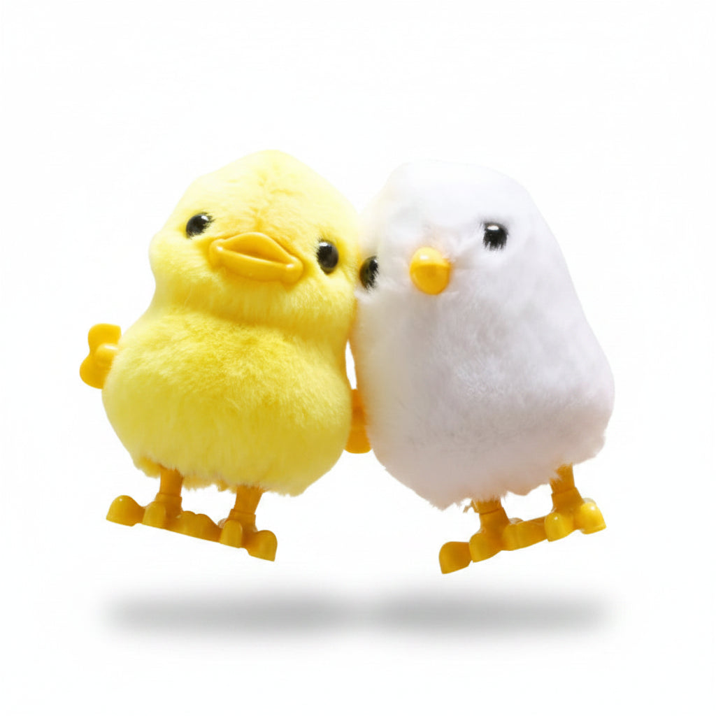 Peluche poussin jaune et peluche poussin blanche à remonter, sur fond blanc